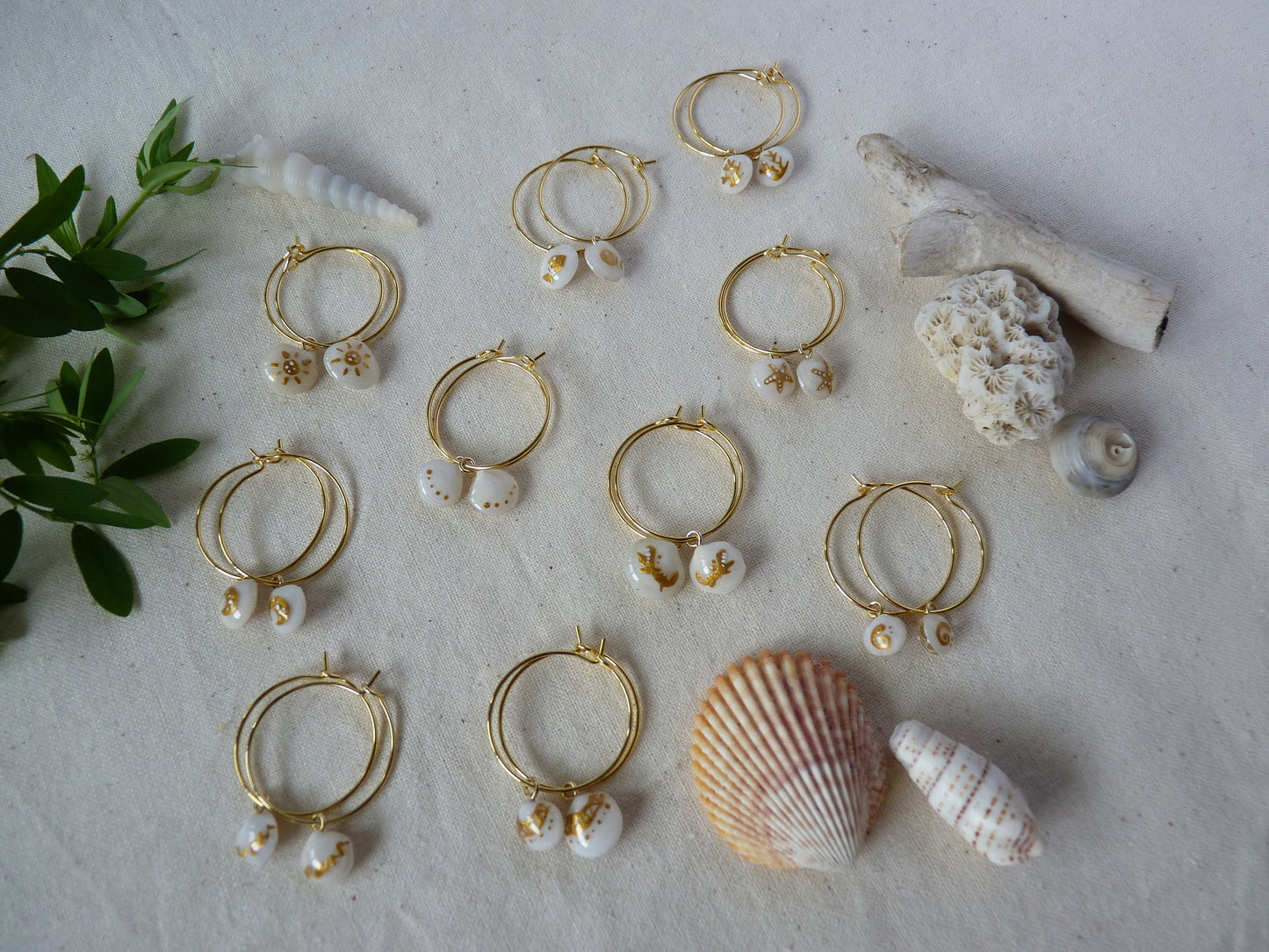 Tiny shell earrings with painting, little sun