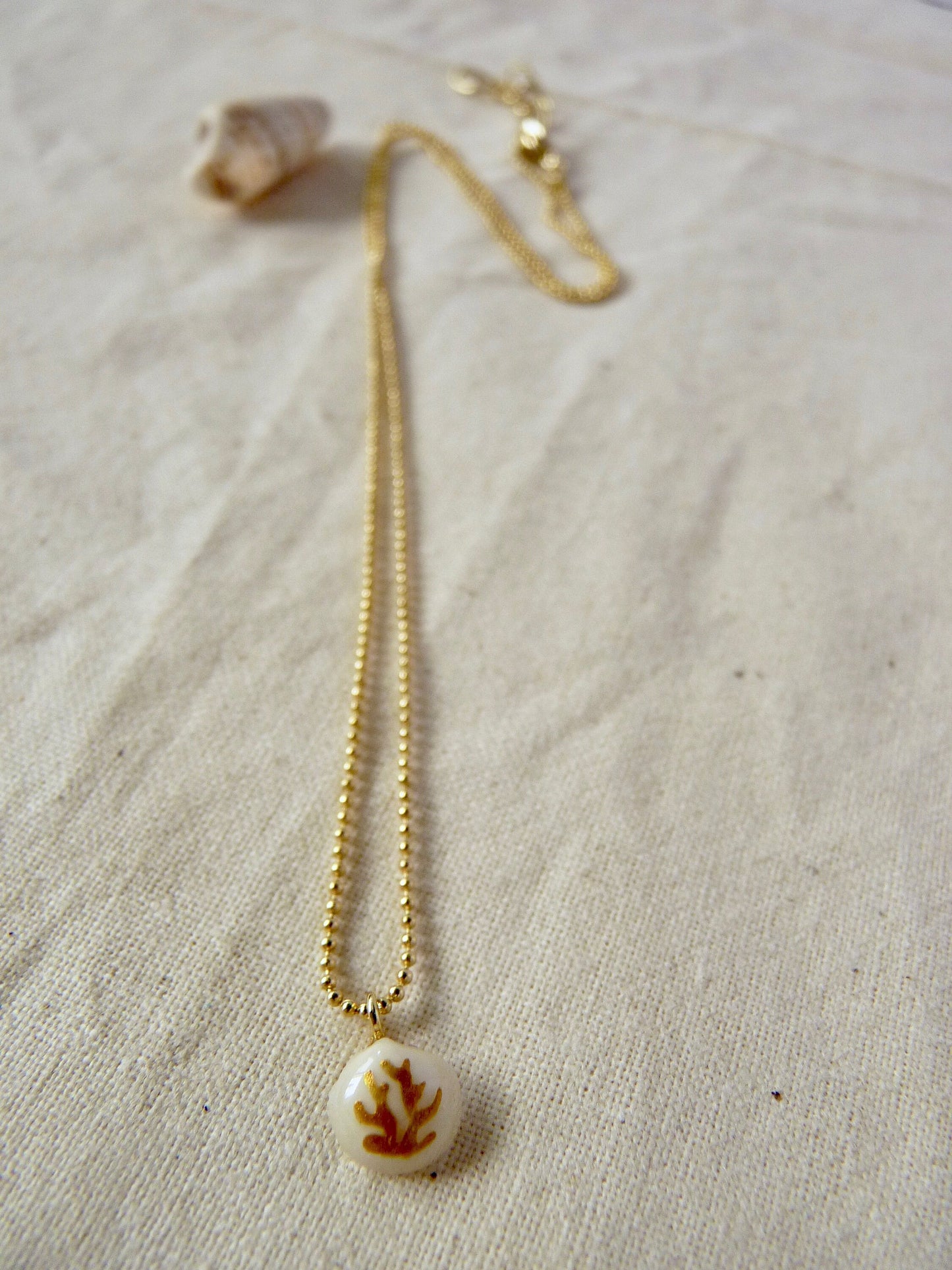 Tiny shell necklace with painting, little algae