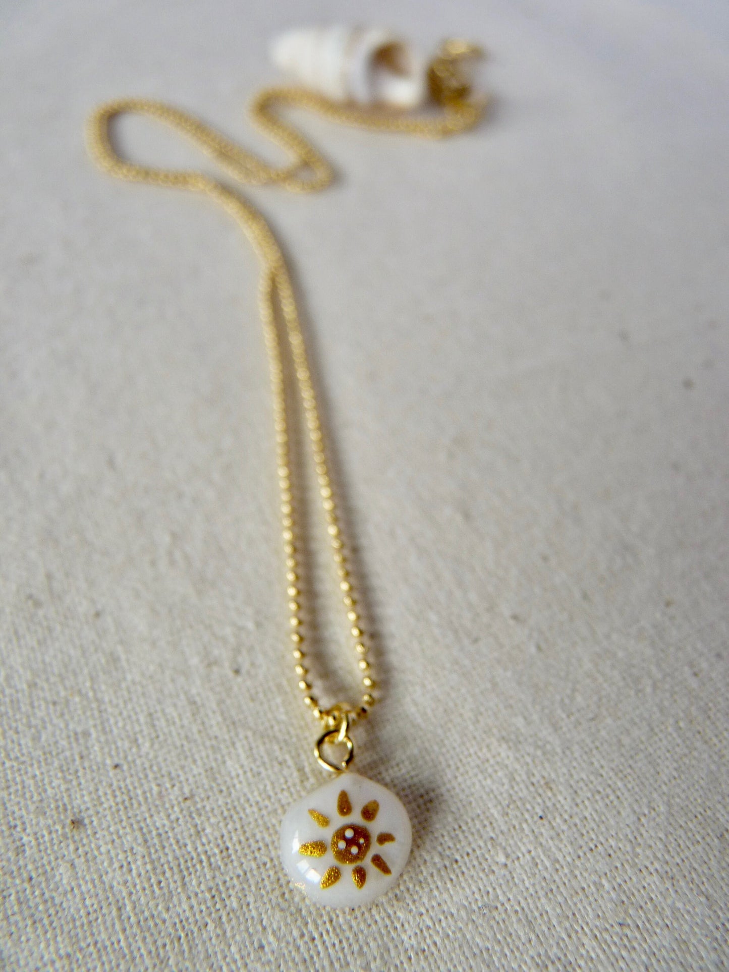 Tiny shell necklace with painting, little sun