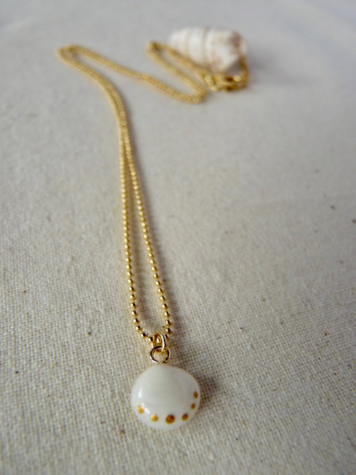 Tiny shell necklace with painting, little dots