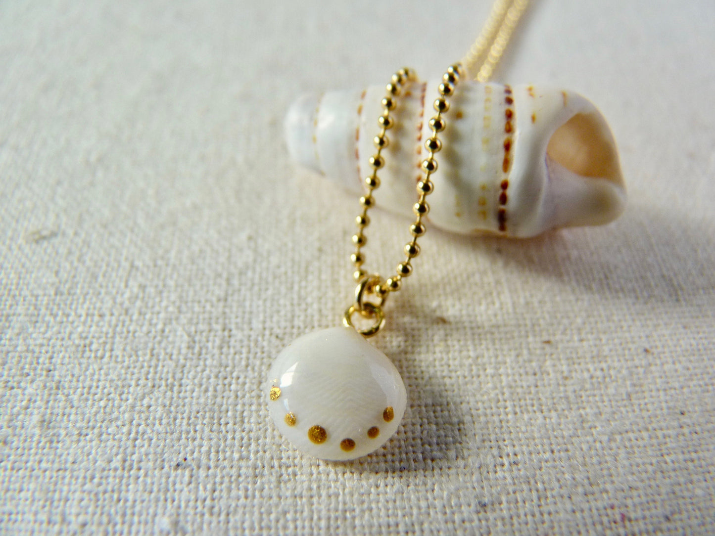 Tiny shell necklace with painting, little dots
