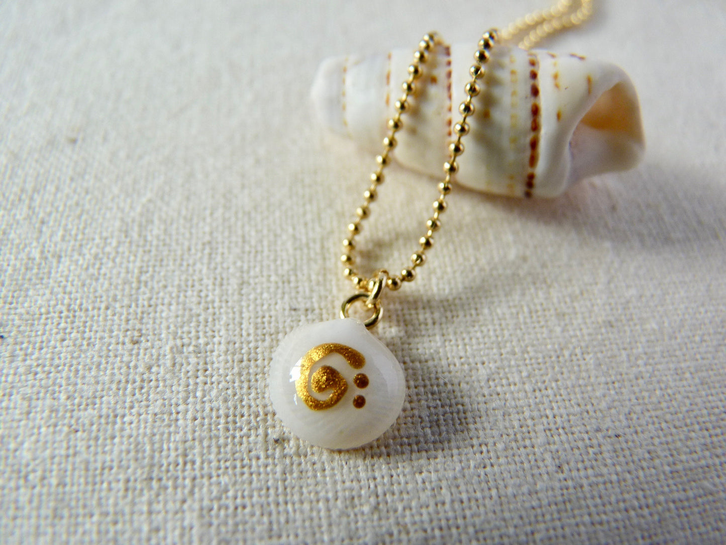 Tiny shell necklace with painting, little swirl