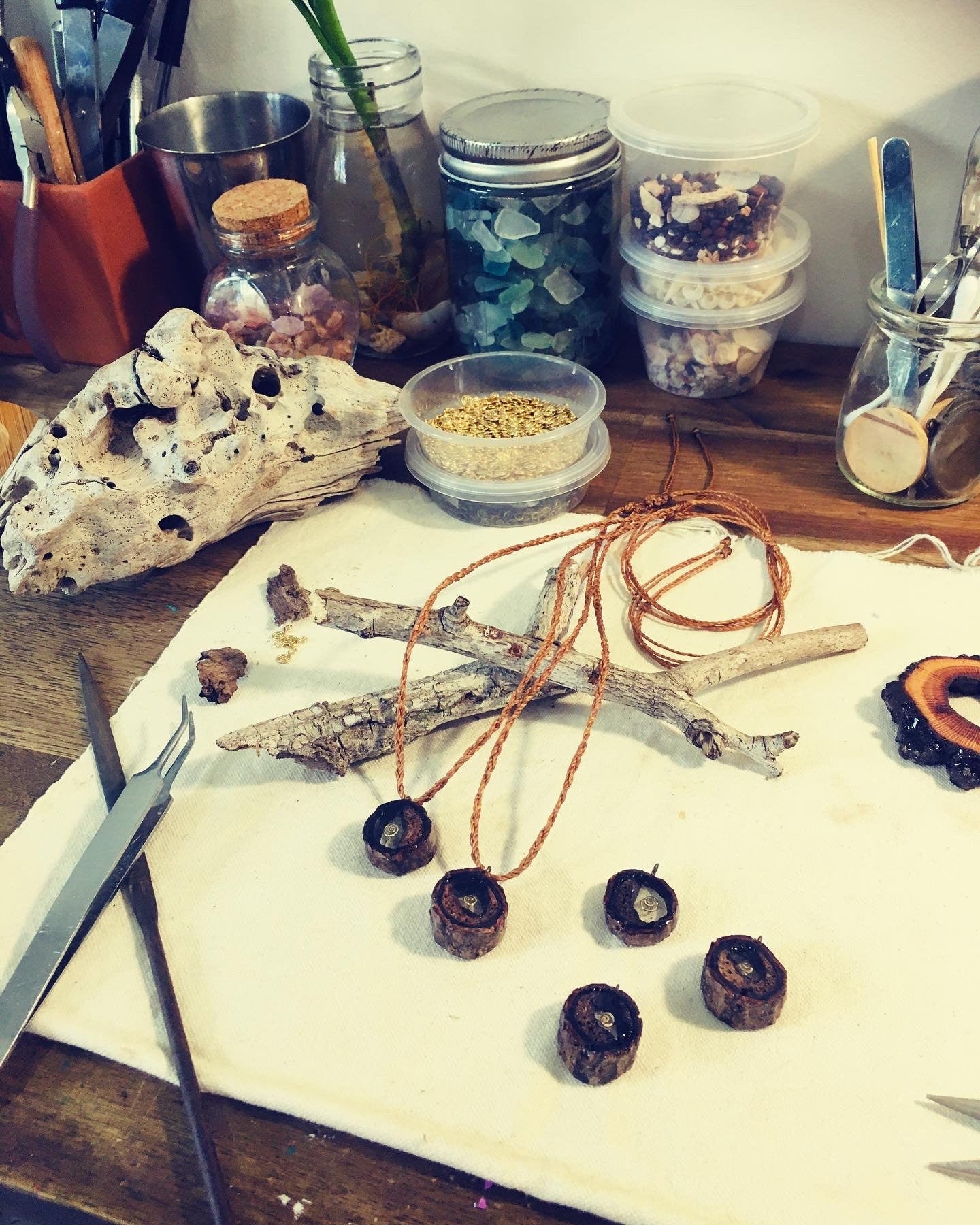 Pendant in rebirth with tree branch