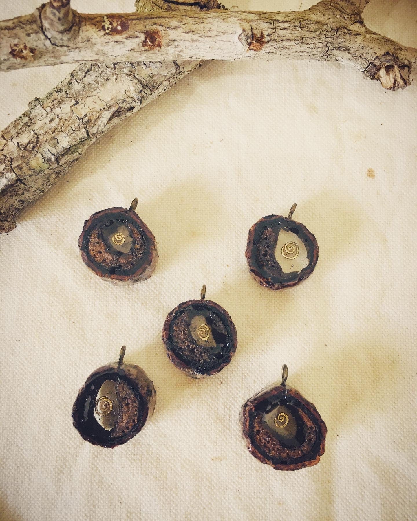 Pendant in rebirth with tree branch