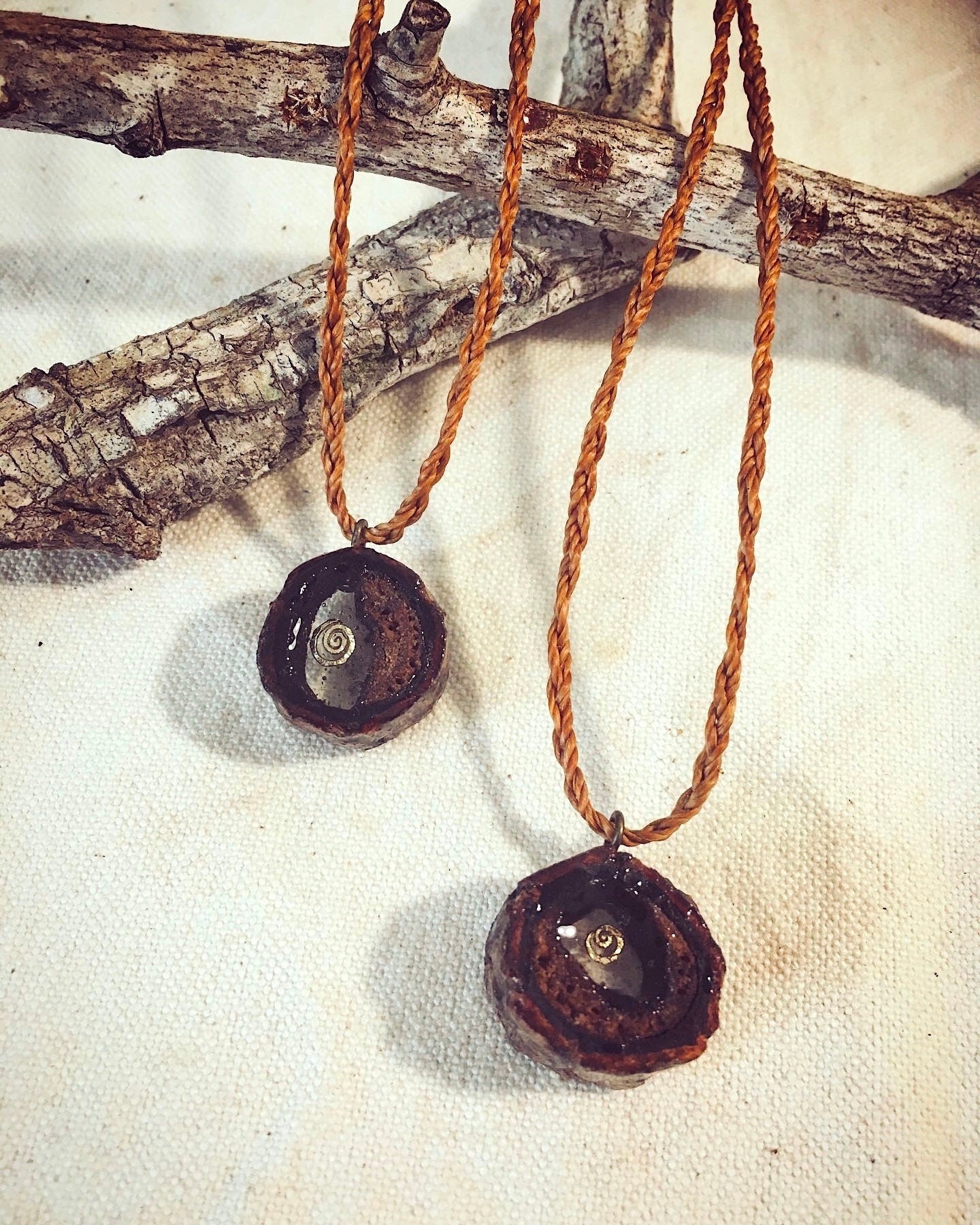 Pendant in rebirth with tree branch