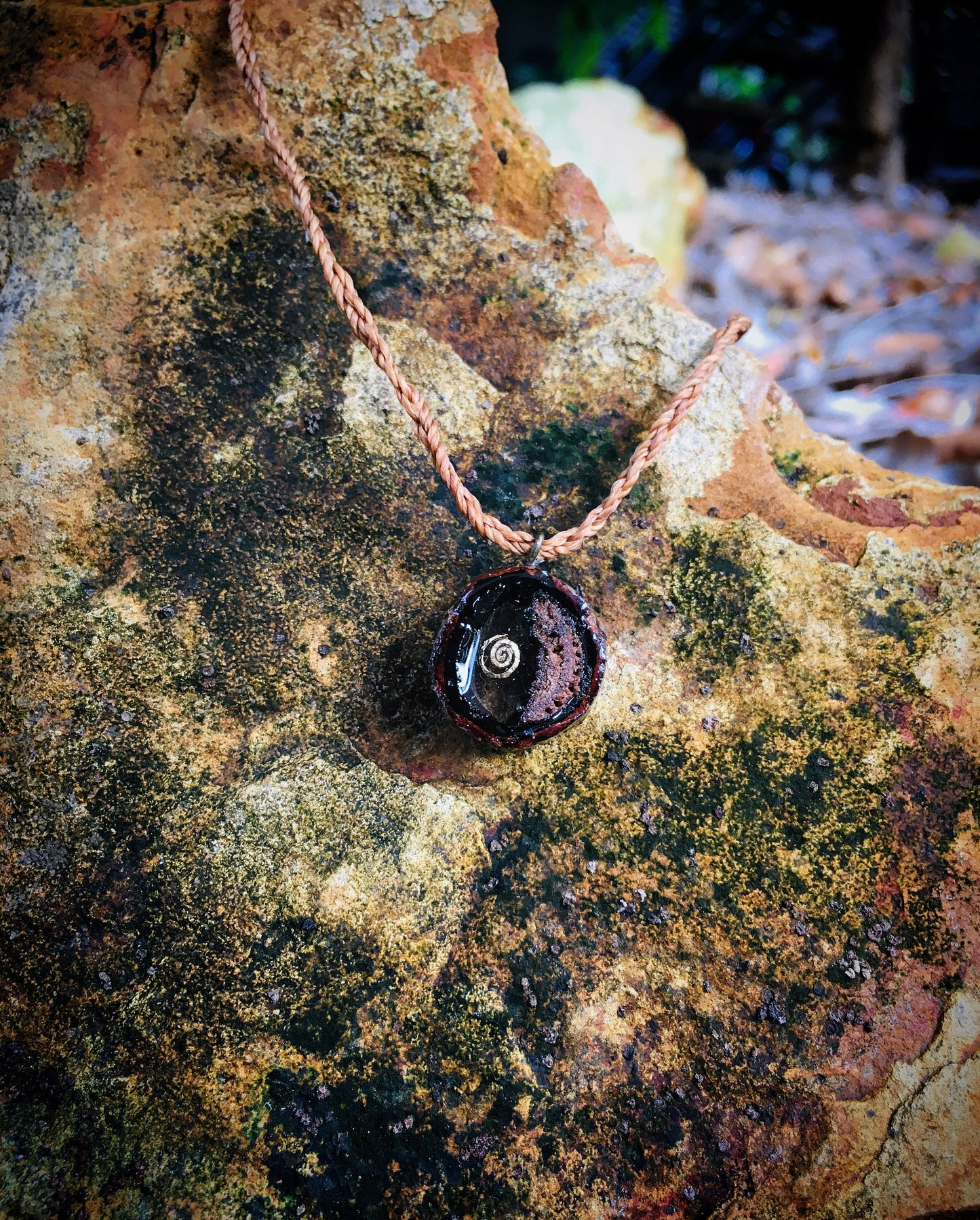 Pendant in rebirth with tree branch